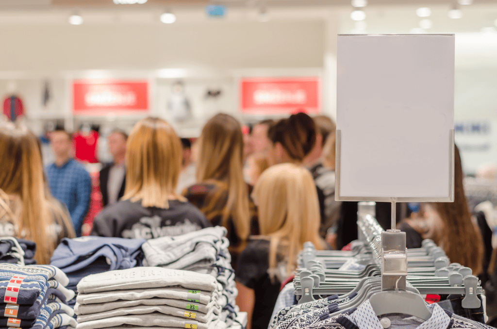 customers waiting in line at crowded store