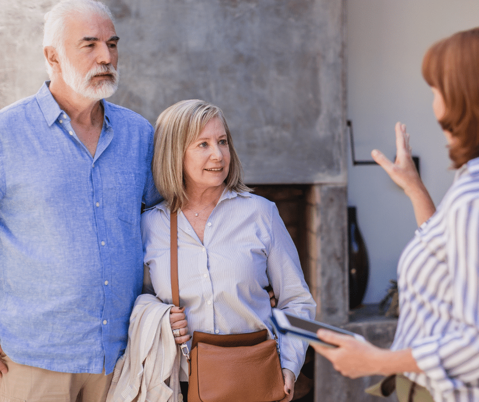 senior couple discusses options and services with senior housing administrator