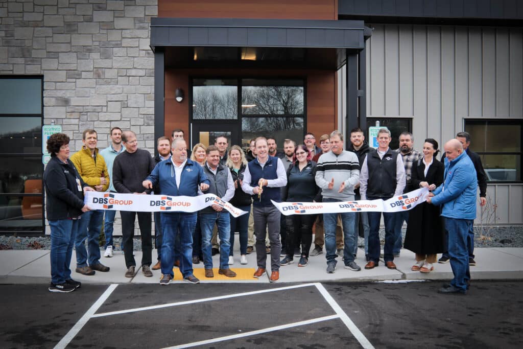 Chris Walters of DBS Group cuts the ribbon on the company's new Onalaska headquarters