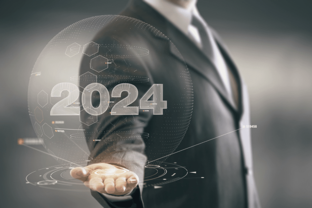 2024 is the year to invest in senior housing is depicted by business man holding holographic image showing 2024 with digital trend indicators.