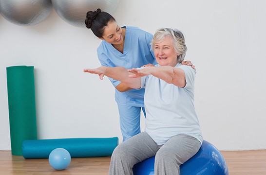 elderly person going through physical therapy