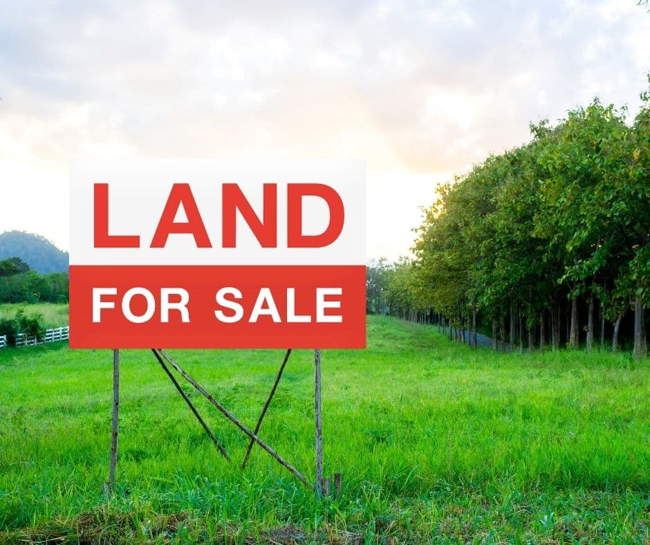 Land contracts 1a Land for sale sign in meadow illustrates land contract option