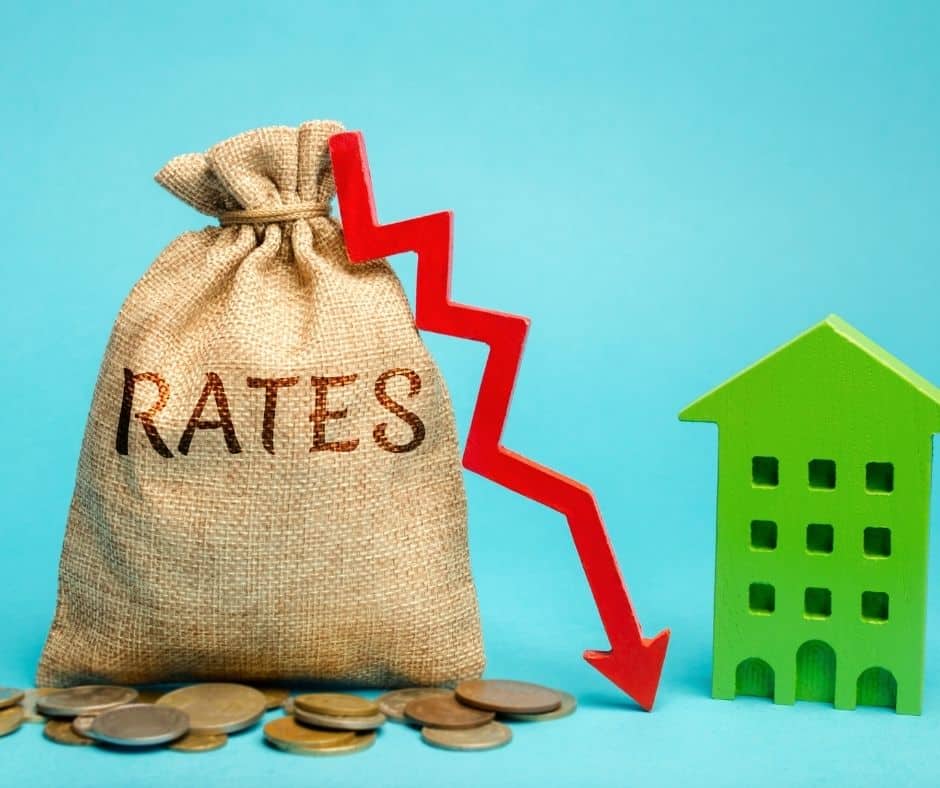 money bag with down arrow and mini building model