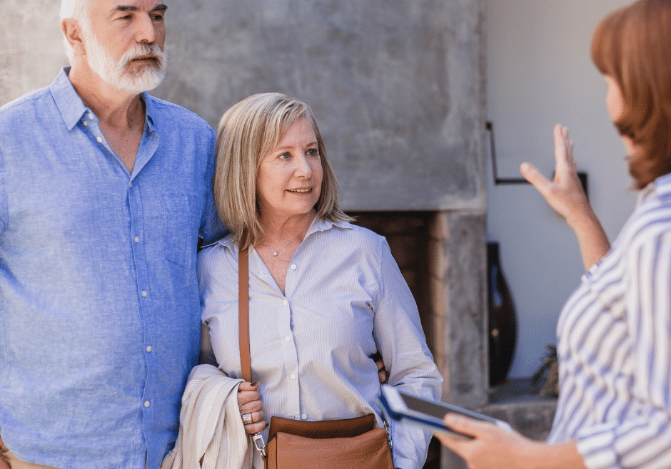 senior couple discusses options and services with senior housing administrator