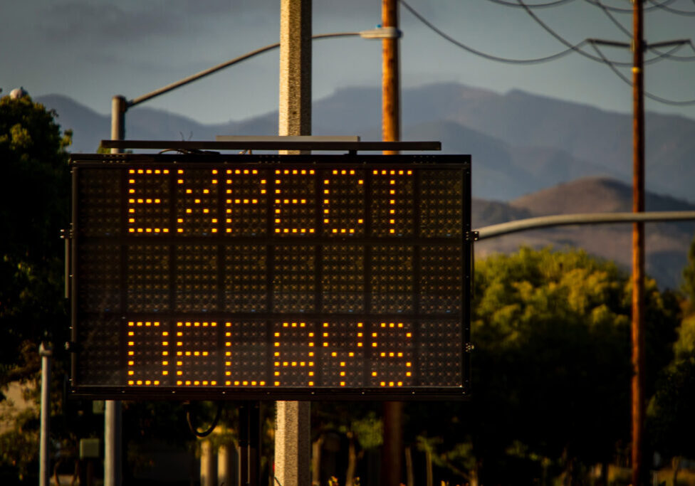 electronic traffic sign that says expect delays